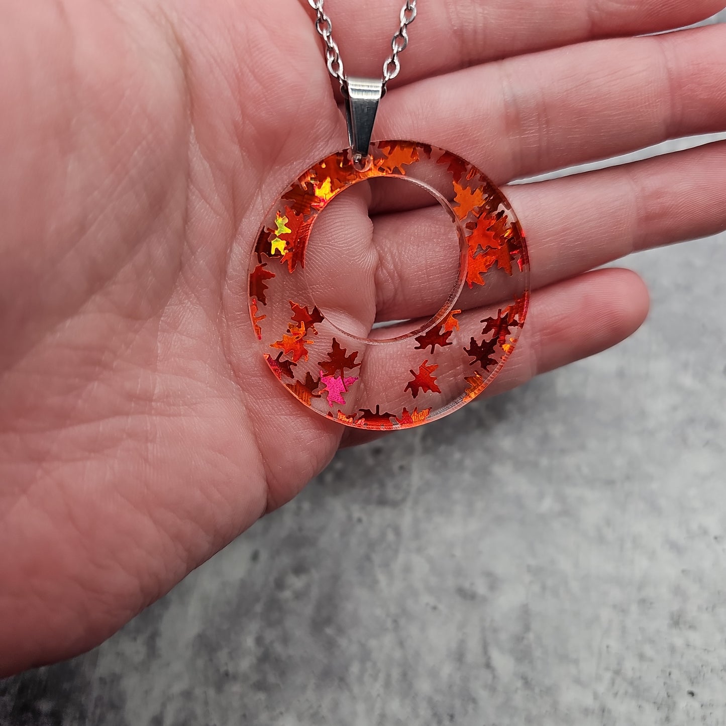 Large Offset Circle Orange Falling Leaves Necklace