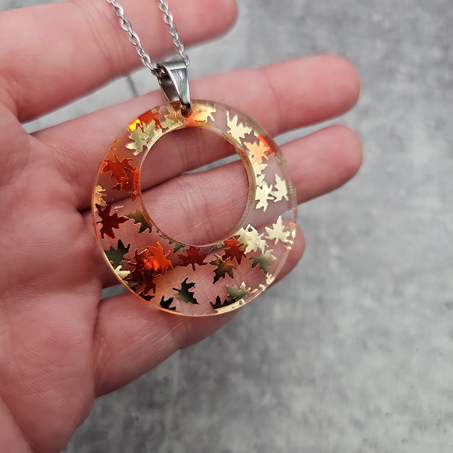 Large Offset Circle Golden Falling Leaves Necklace