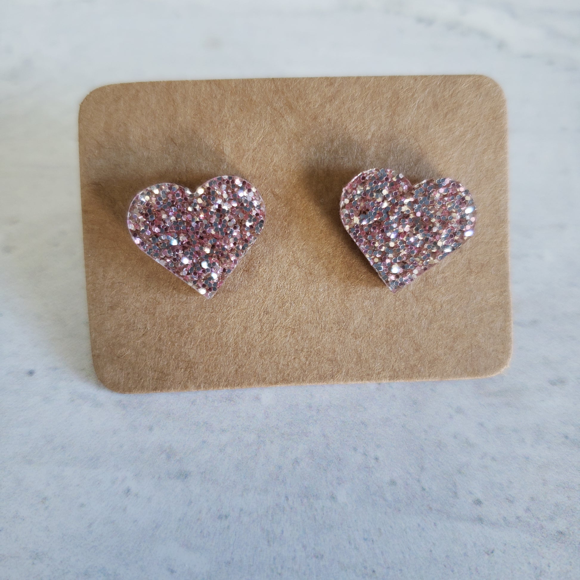 Rose gold glitter heart shaped stud earrings