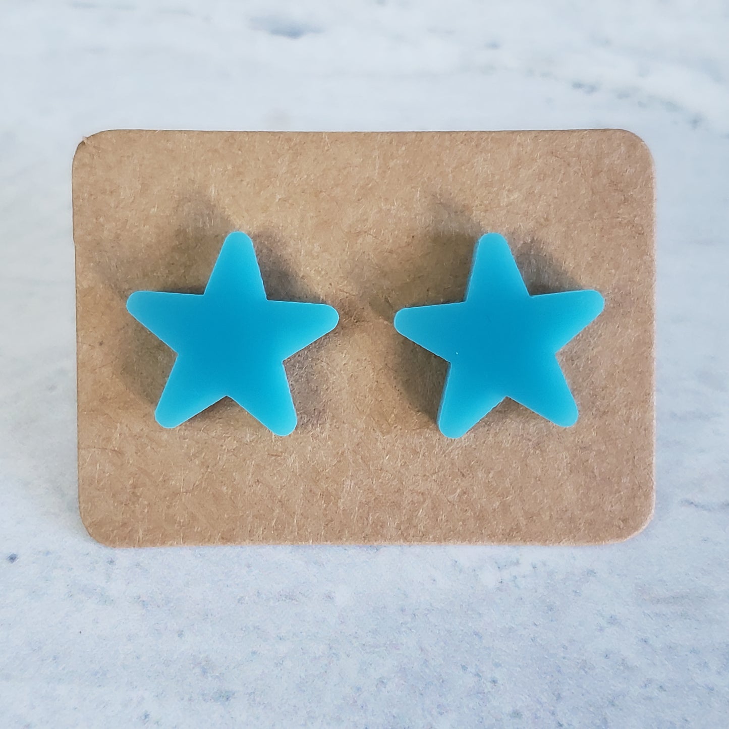 Breakfast blue star stud earrings on earring card