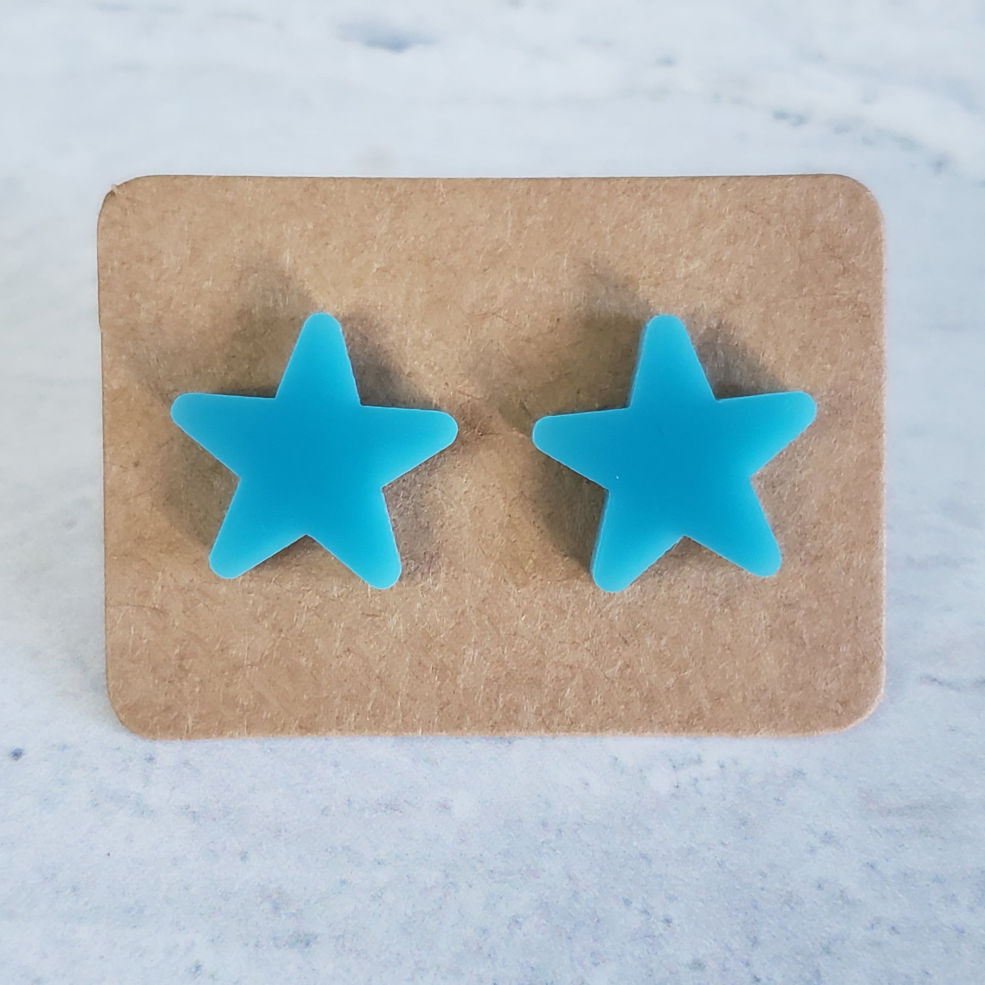 Breakfast blue star stud earrings on earring card