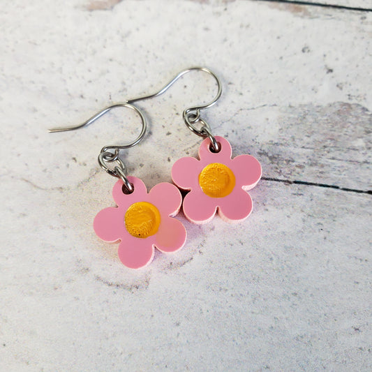 Small matte pink daisy flowers on small stainless steel wires.