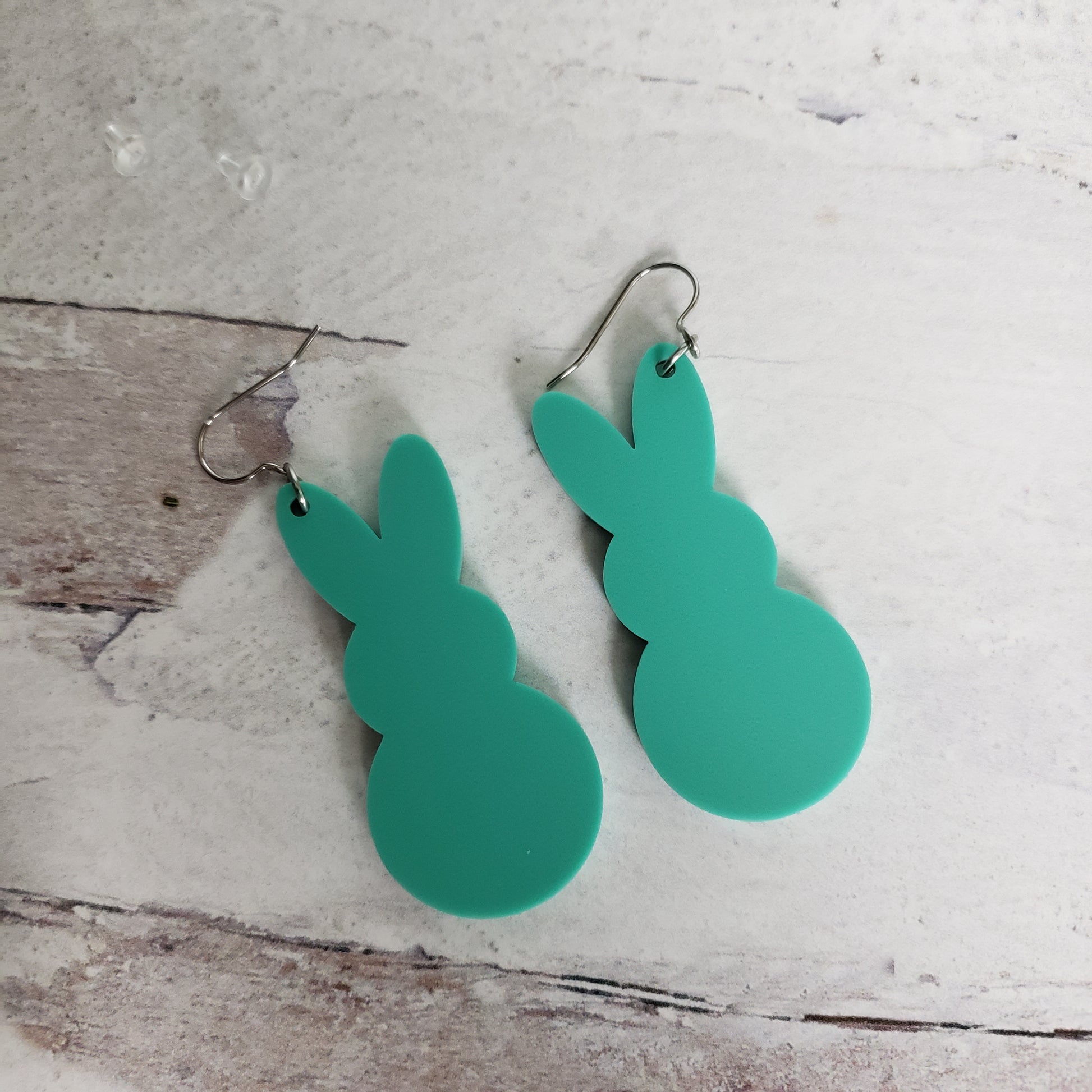 Backside of Matte Mint Green Marshmallow Bunny Earrings on stainless earring wires.