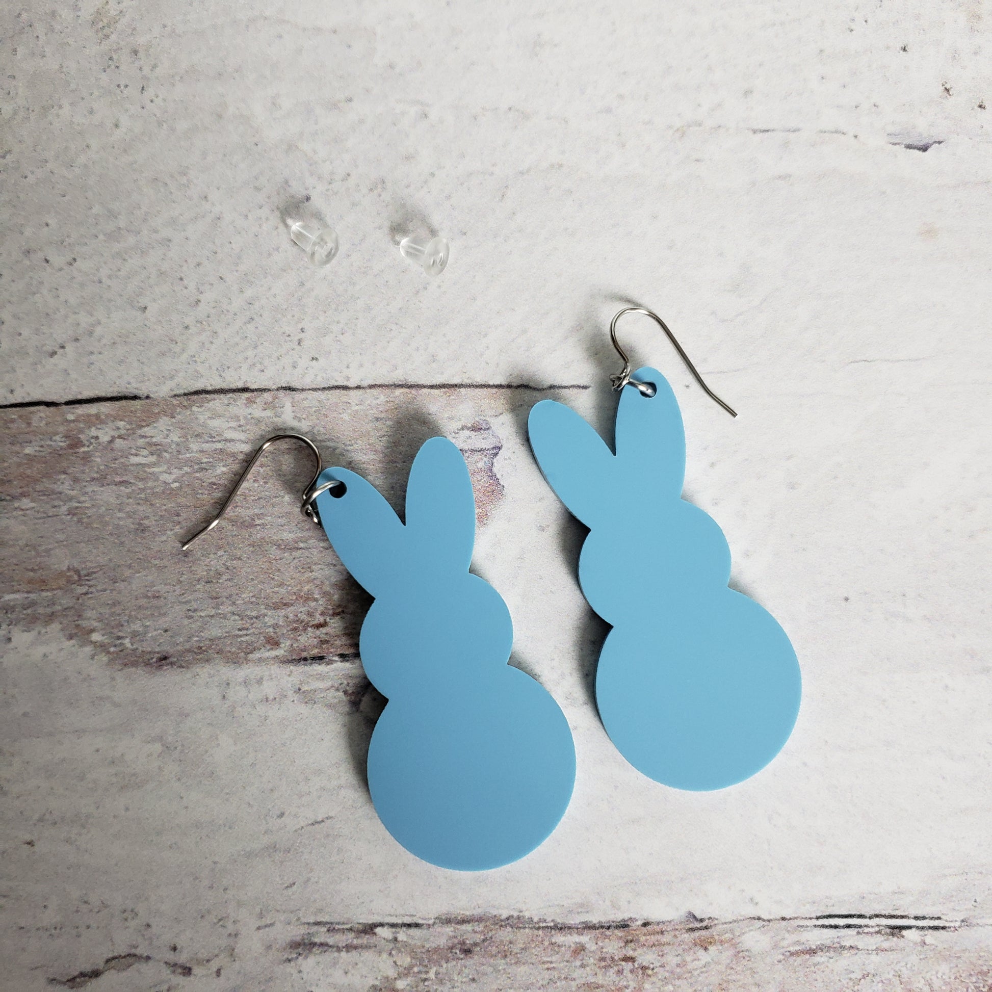 Backside of Matte pastel blue Marshmallow Bunny Earrings on stainless earring wires.