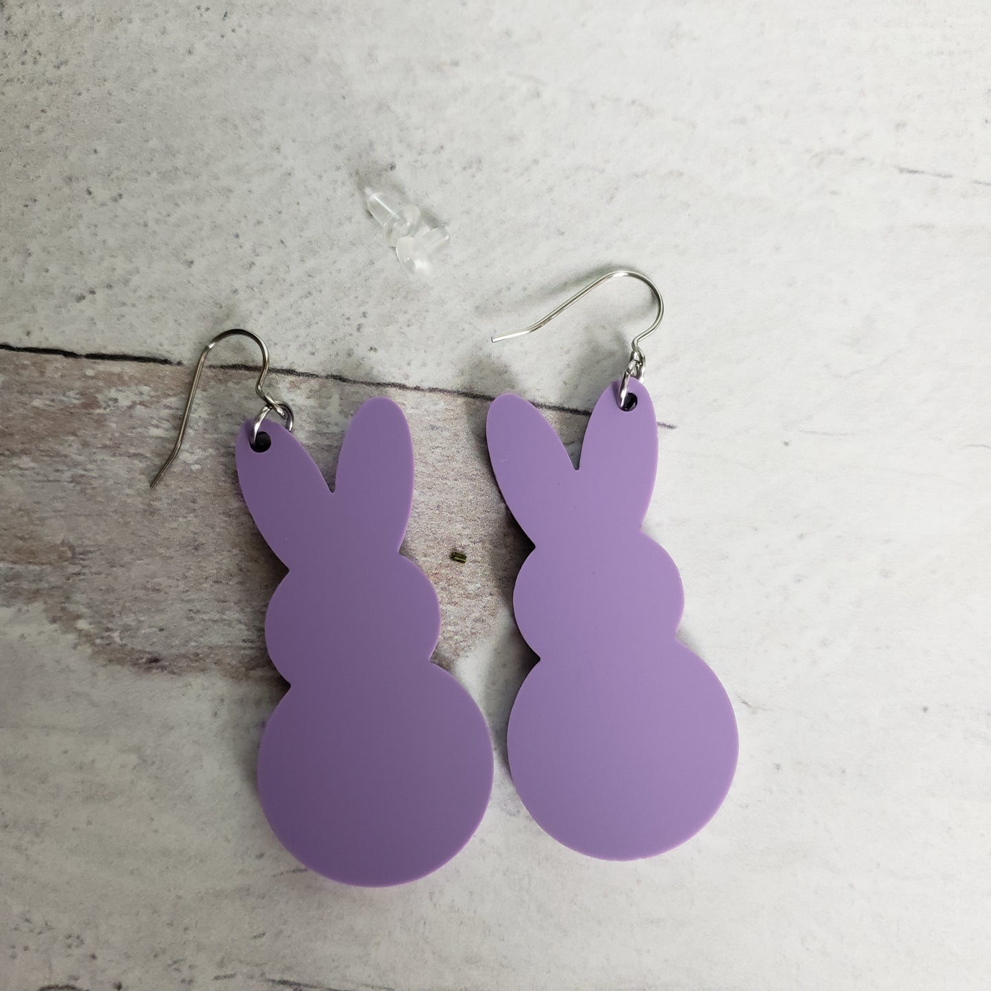 backside of Matte pastel purple Marshmallow Bunny Earrings on stainless earring wires.