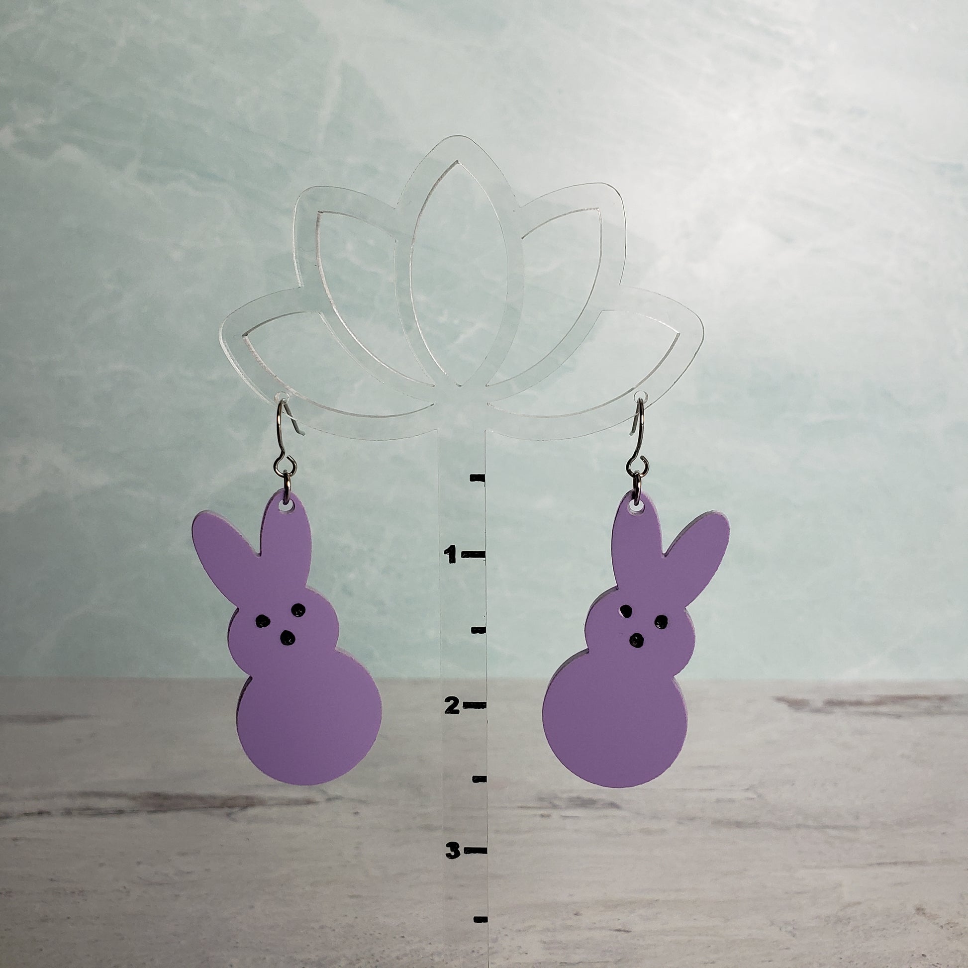 Matte pastel purple Marshmallow Bunny Earrings on stainless earring wires. on hanging display