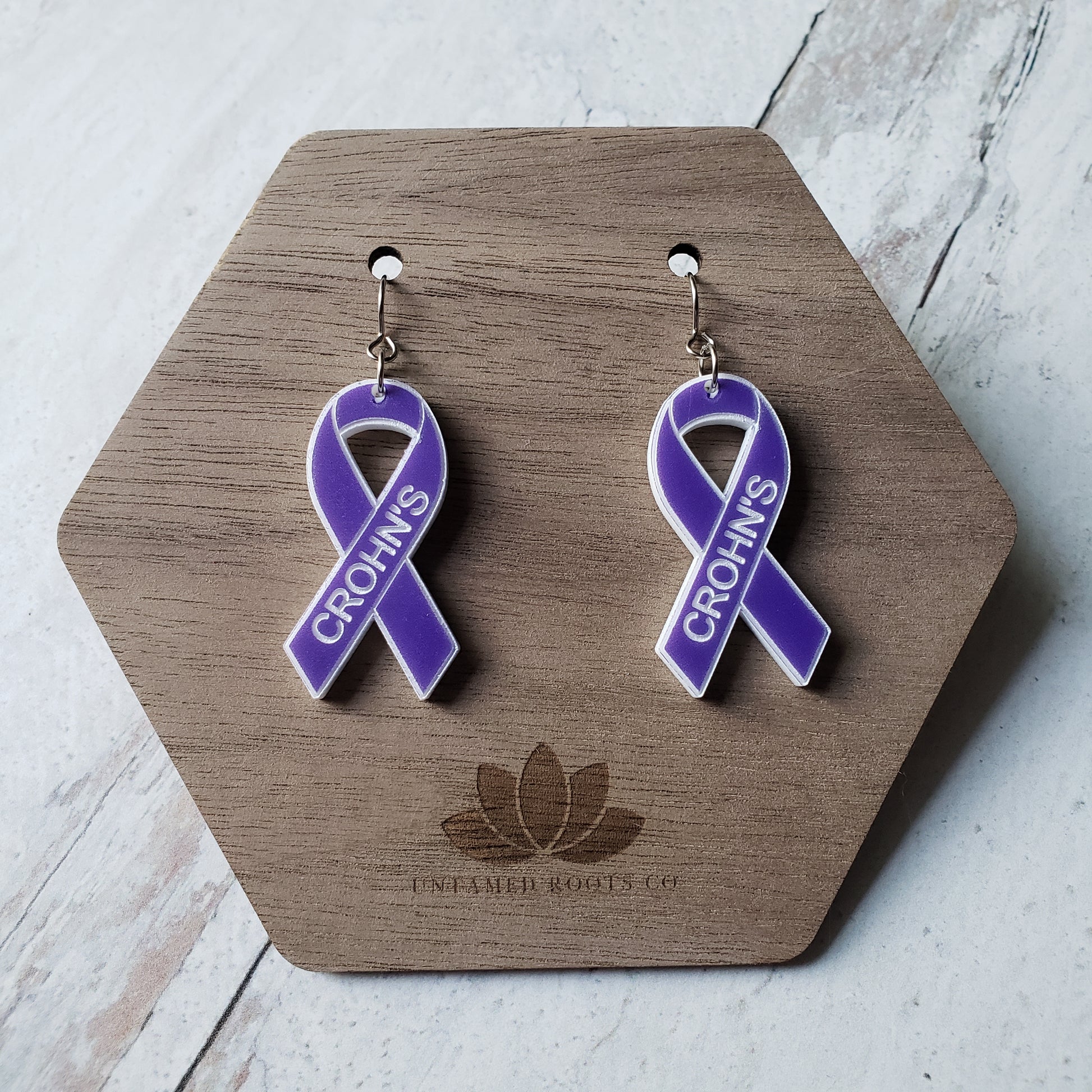 Pair of purple awareness ribbons, with engraving. Stainless steel earring wires.