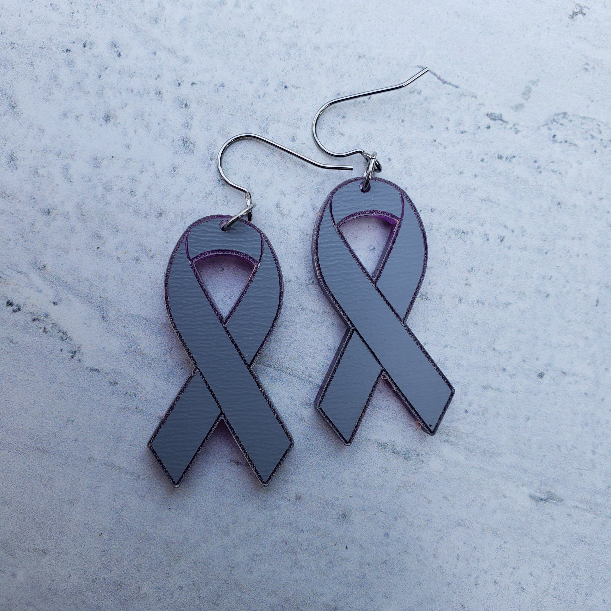 Backside of Classic purple mirror acrylic awareness ribbons on stainless steel earring wires.