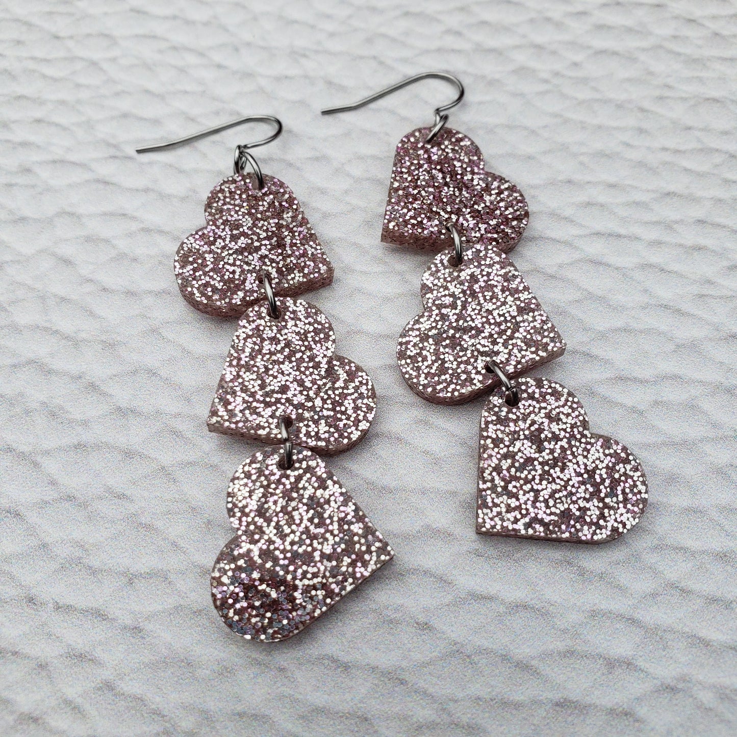 Rose Gold Glitter Tumbling Heart Earrings on Stainless Steel