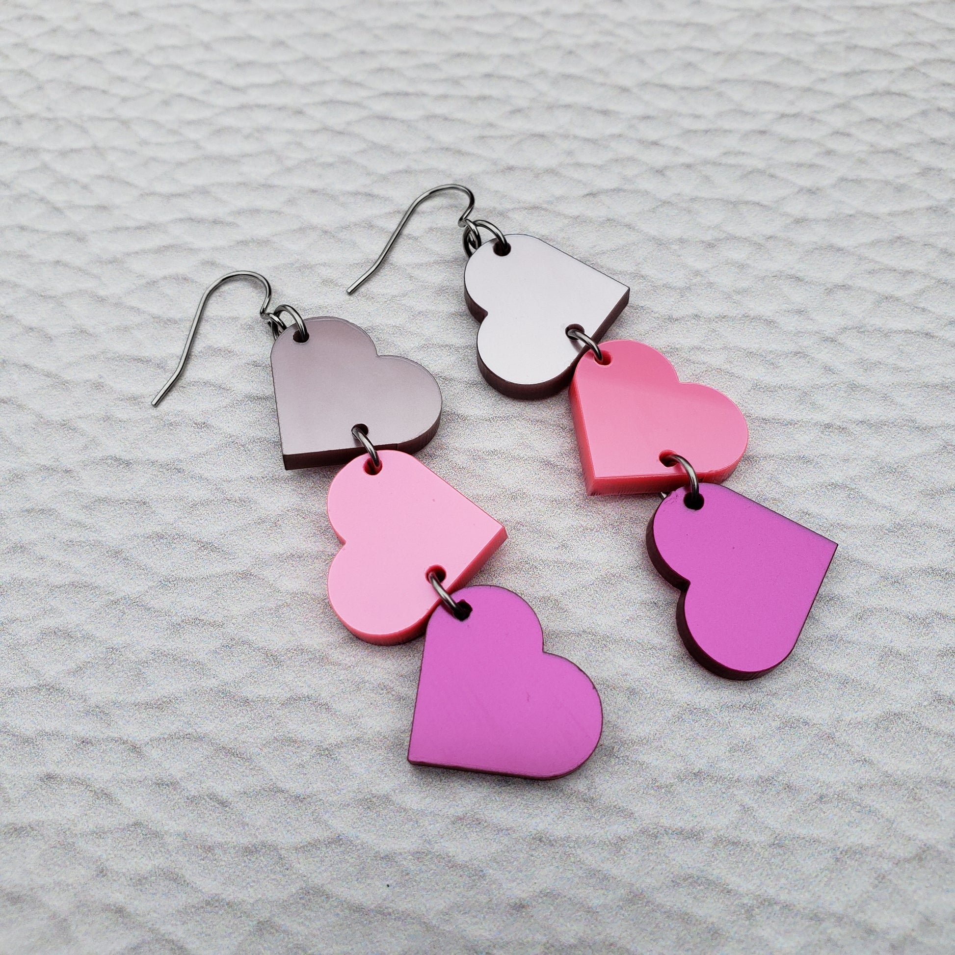 Pink Metallic Tumbling Heart Earrings on Stainless Steel
