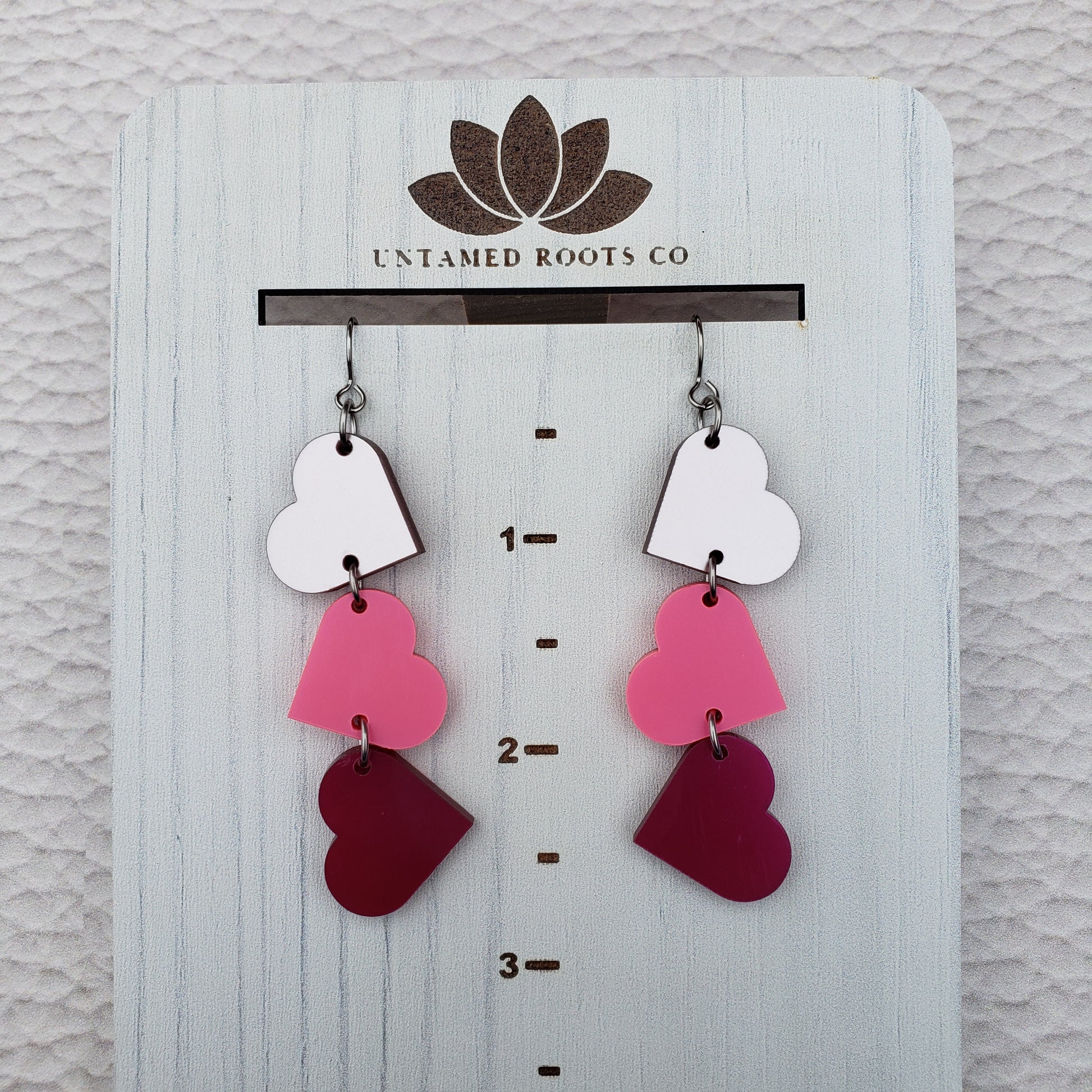 Pink Metallic Tumbling Heart Earrings on Stainless Steel