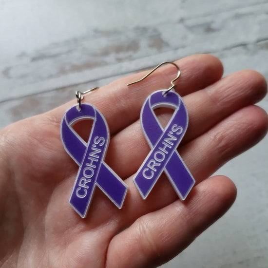 Video of Pair of purple awareness ribbons, with engraving. Stainless steel earring wires.