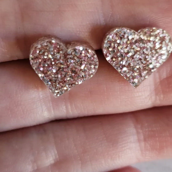 video of rose gold glitter heart shaped stud earrings
