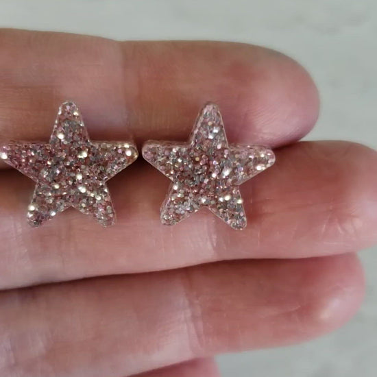 Video of rose gold tone glitter star shaped earrings to show glitter effect