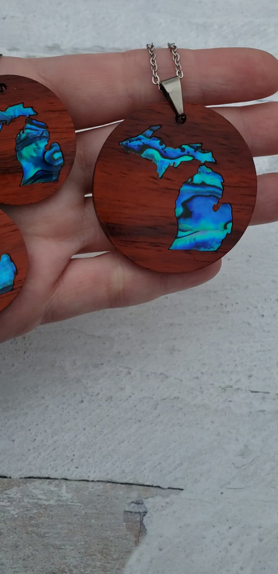 Michigan State shape in abalone inlayed into African Padauk wood.