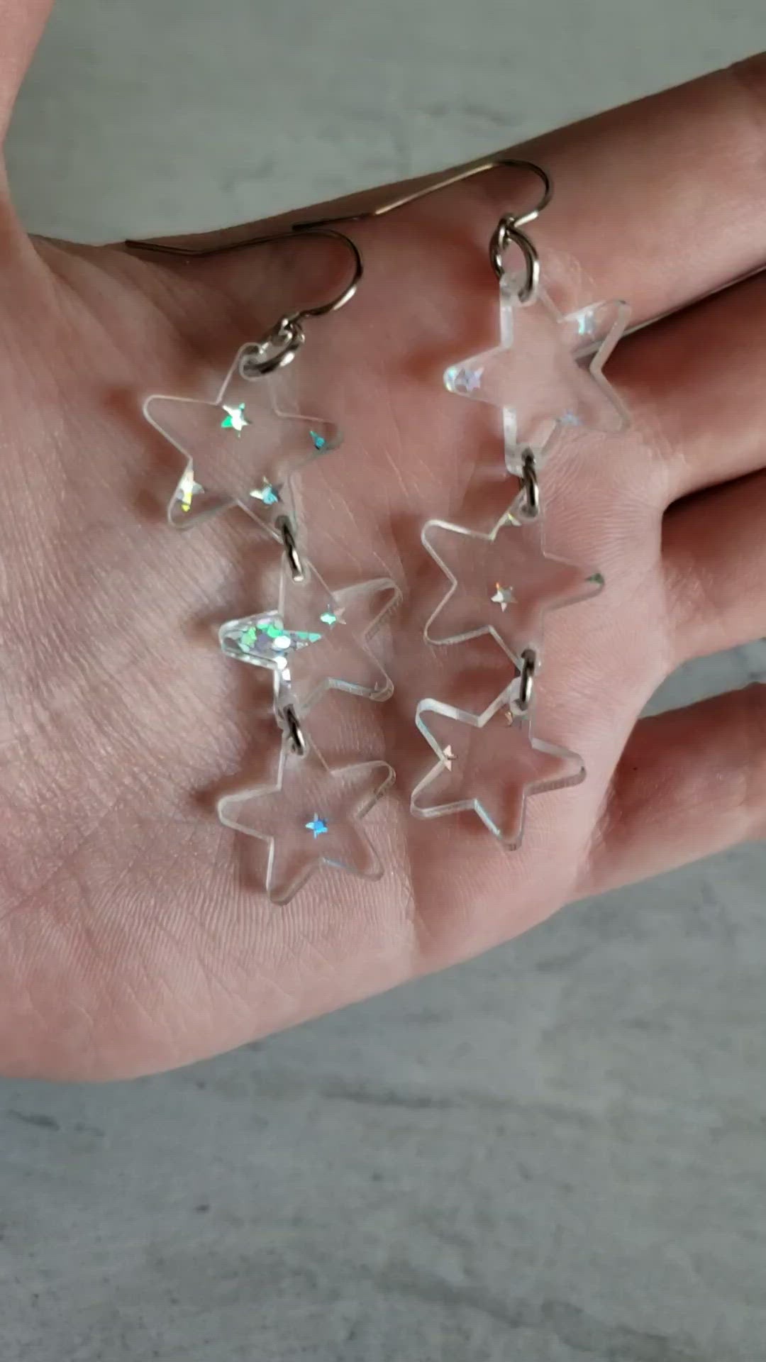 Video of clear holographic star print dangle earrings to show effect.