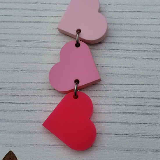 Matte Pink Tumbling Heart Earrings on Stainless Steel