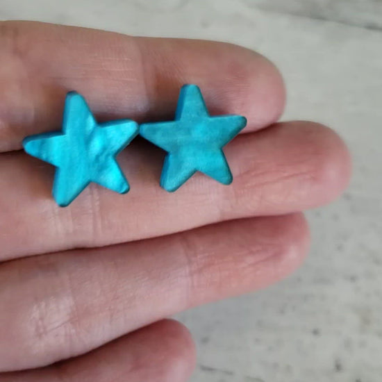 Video showing pearlescent effect of acrylic for blue pearl star stud earrings