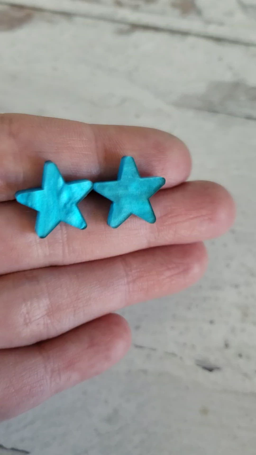 Video showing pearlescent effect of acrylic for blue pearl star stud earrings